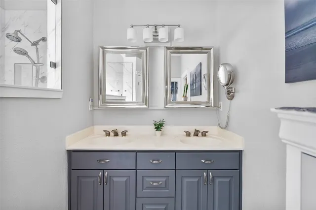 a bathroom with a sink and a mirror
