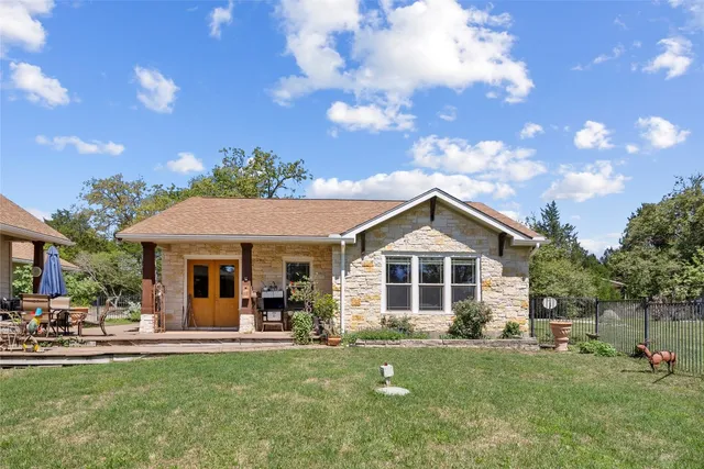 a view of a house with a yard porch and sitting area
