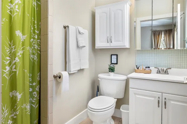 a bathroom with a toilet sink and tub