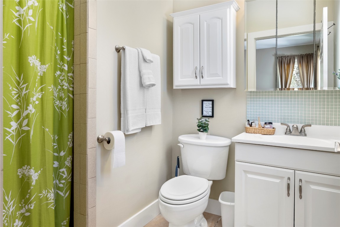 119 Maple Leaf Trail Elgin, TX 78621 - Photo 34 of 40 a bathroom with a toilet sink and tub