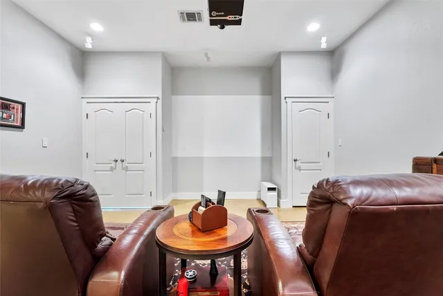 a living room with furniture and a chair