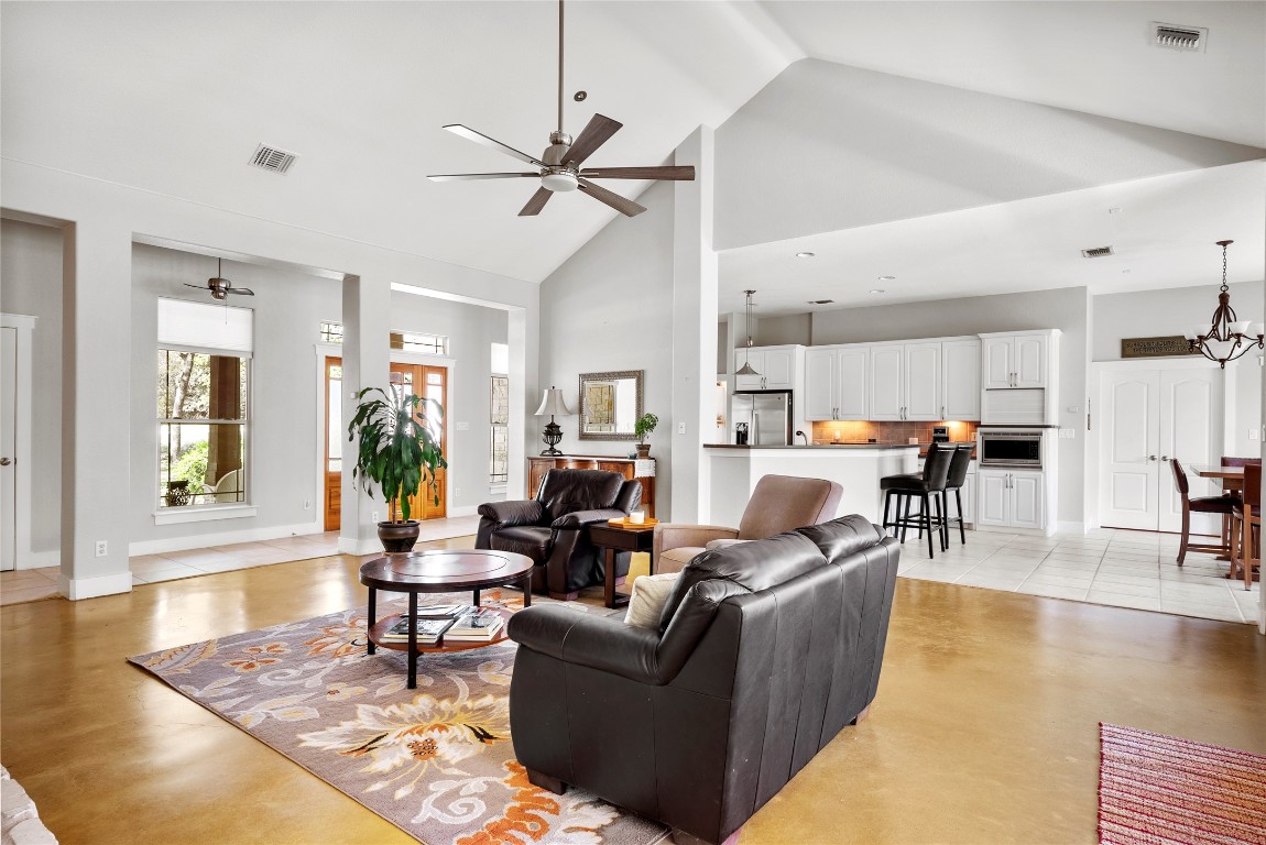 119 Maple Leaf Trail Elgin, TX 78621 - Photo 5 of 40 a living room with furniture and a view of kitchen