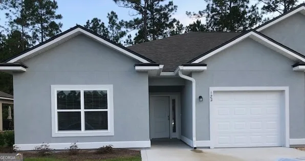a house with trees in the background