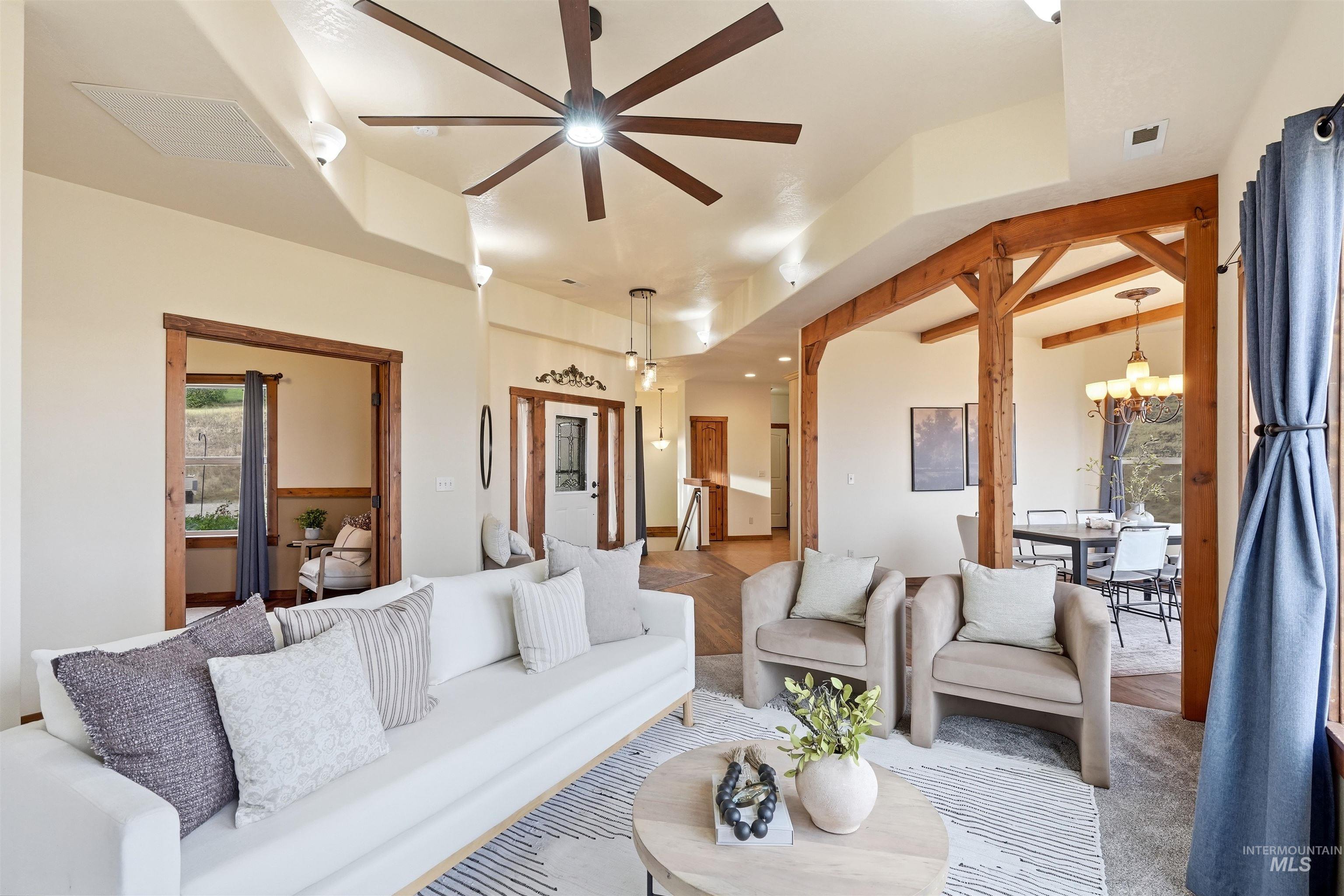 3645 Butte Road Emmett, ID 83617 - Photo 13 of 39 High ceilings with a prominent ceiling fan, exposed wood beams, recessed lighting, and wood-finish flooring