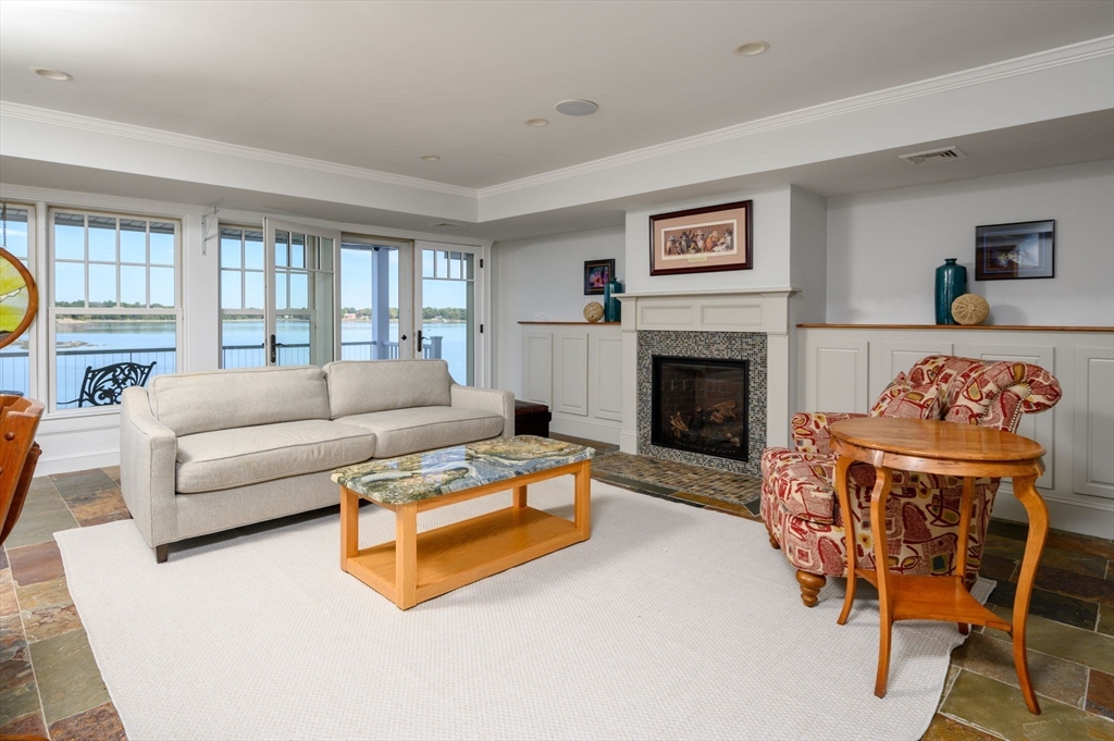 171 Otis Street Hingham, MA 02043 - Photo 19 of 29 a living room with furniture and a fireplace