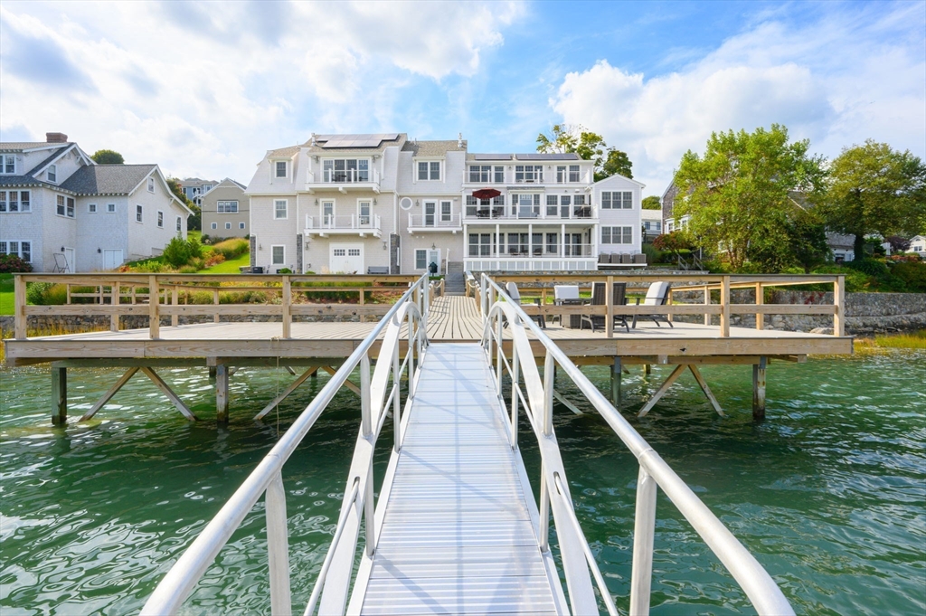 171 Otis Street Hingham, MA 02043 - Photo 23 of 29 a view of building with yard and staircase