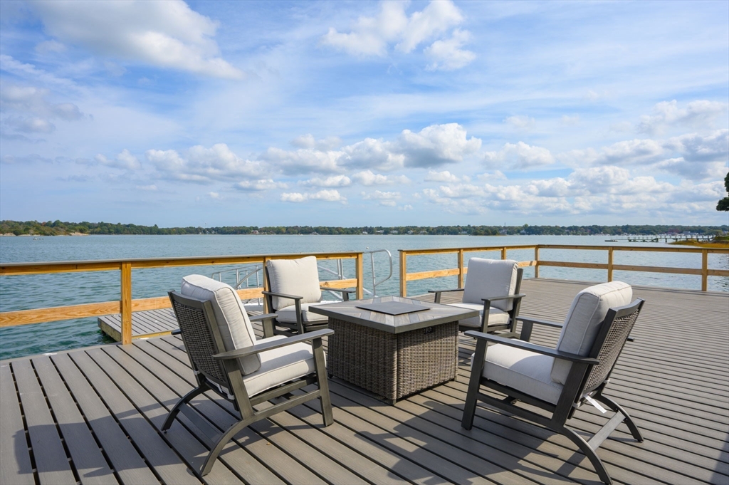 171 Otis Street Hingham, MA 02043 - Photo 24 of 29 a balcony with wooden floor and city view