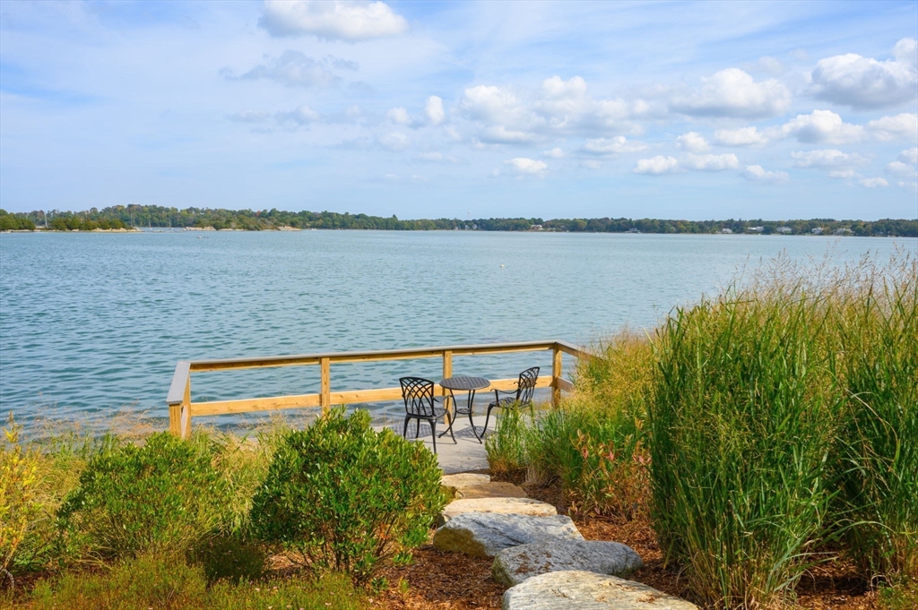 171 Otis Street Hingham, MA 02043 - Photo 27 of 29 a view of a lake with a garden and trees