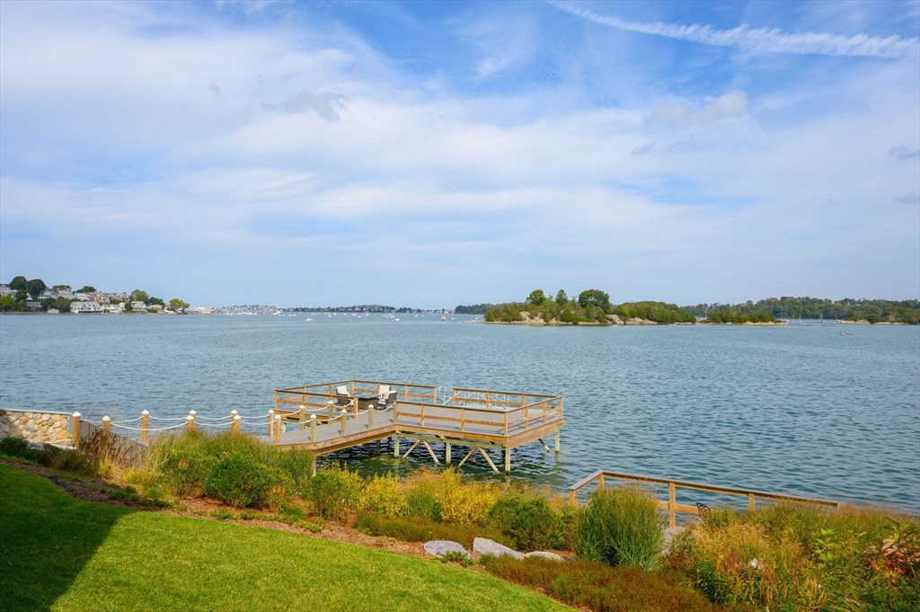 171 Otis Street Hingham, MA 02043 - Photo 28 of 29 a view of a lake with houses in the back