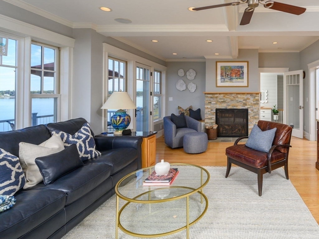 171 Otis Street Hingham, MA 02043 - Photo 7 of 29 a living room with furniture and a fireplace