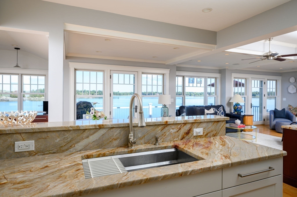 171 Otis Street Hingham, MA 02043 - Photo 10 of 29 a view of living room with granite countertop furniture and fireplace