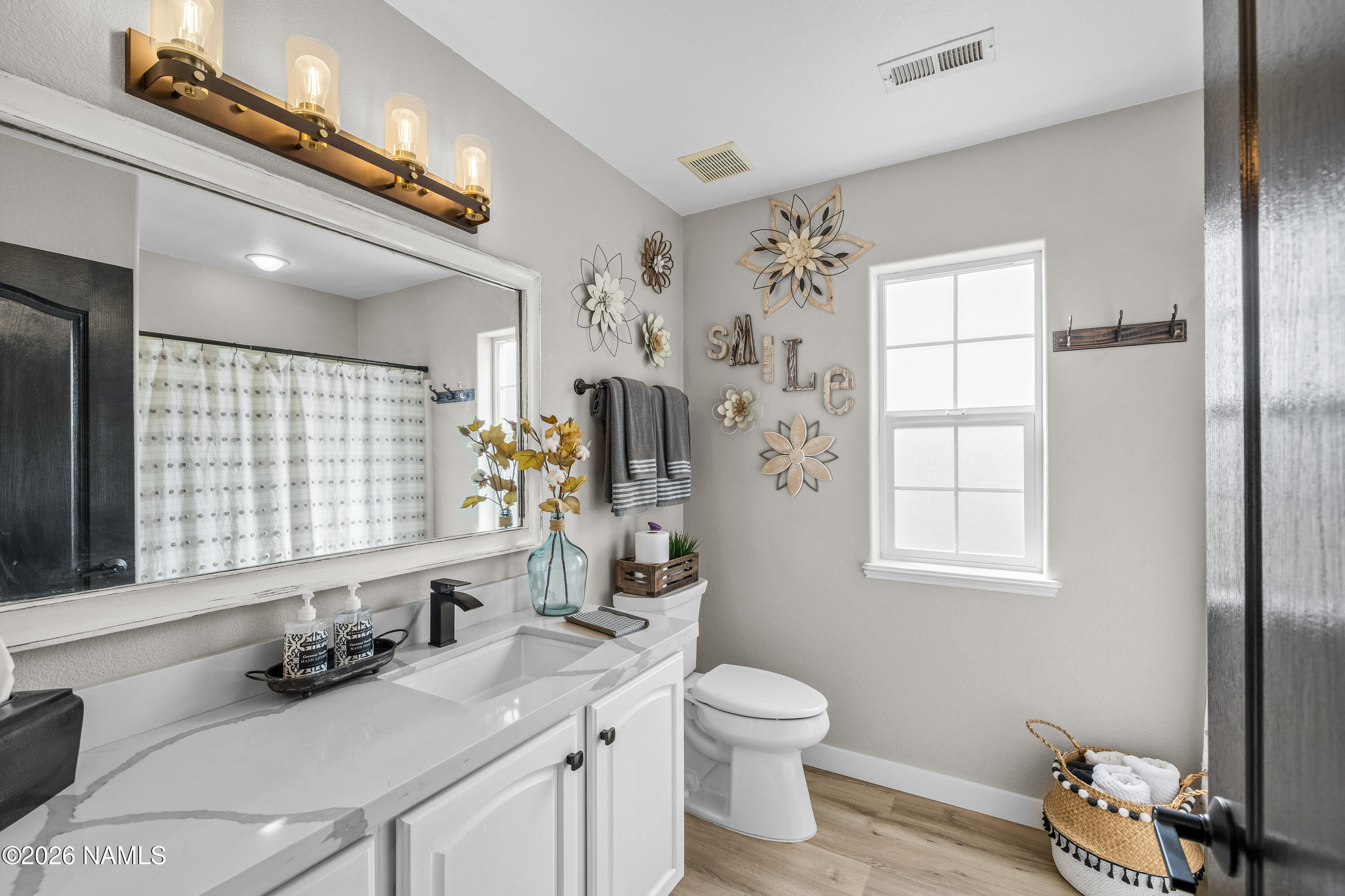 9534 North Aldrich Road Flagstaff, AZ 86004 - Photo 16 of 31 a bathroom with a sink a toilet and shower