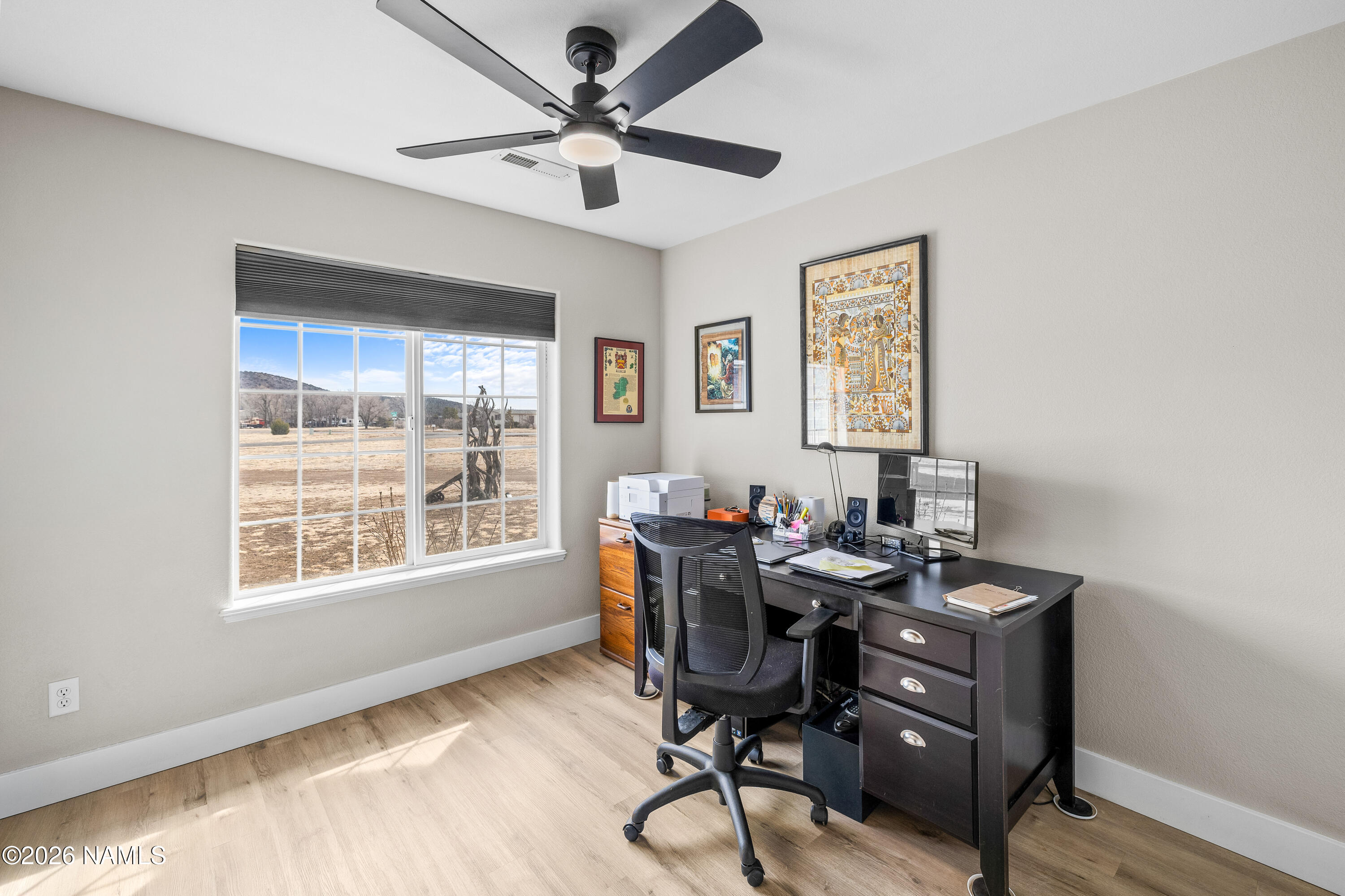 9534 North Aldrich Road Flagstaff, AZ 86004 - Photo 18 of 31 a view of a workspace with furniture and a window
