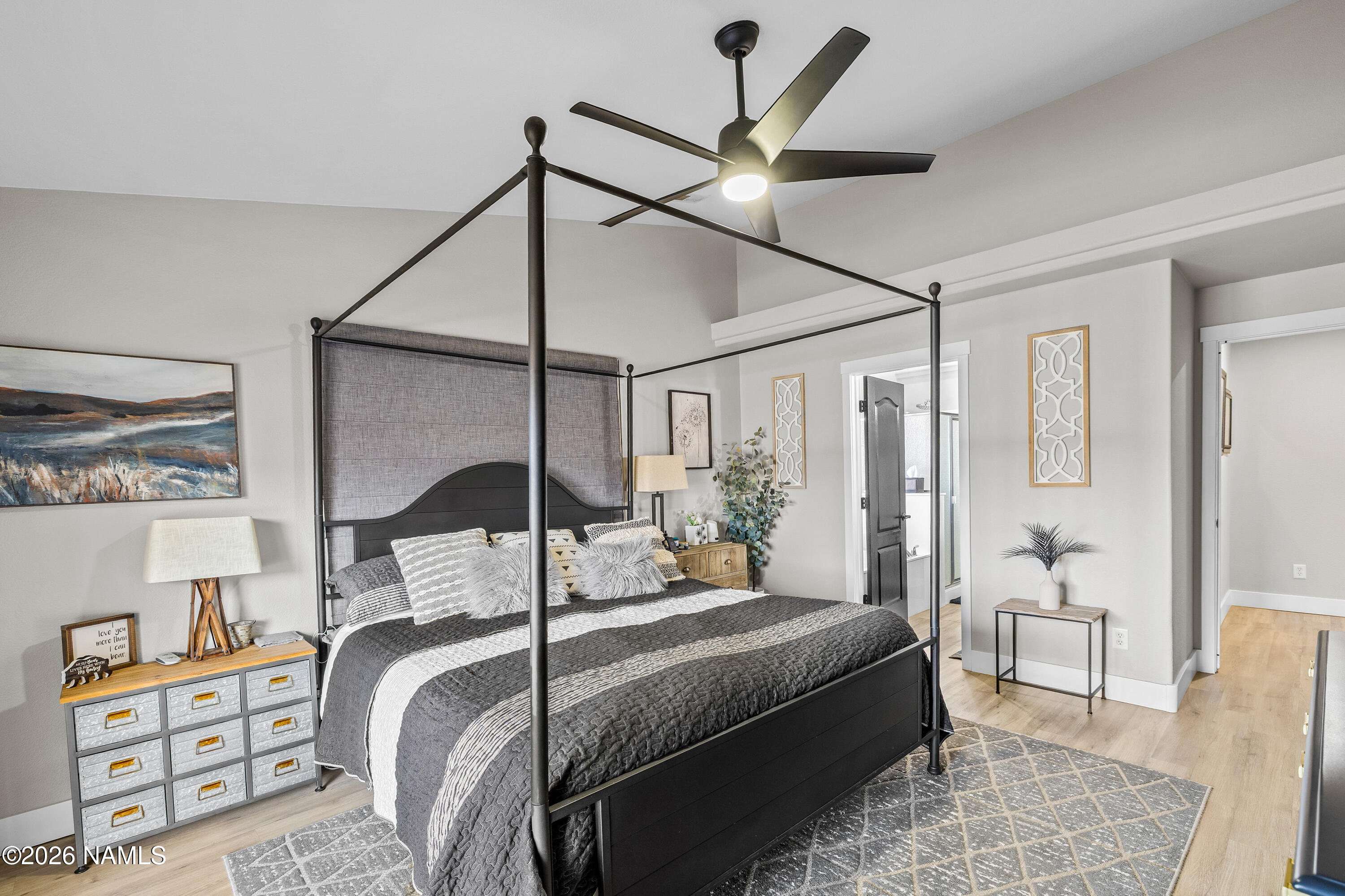 9534 North Aldrich Road Flagstaff, AZ 86004 - Photo 21 of 31 a bedroom with a bed and a chandelier