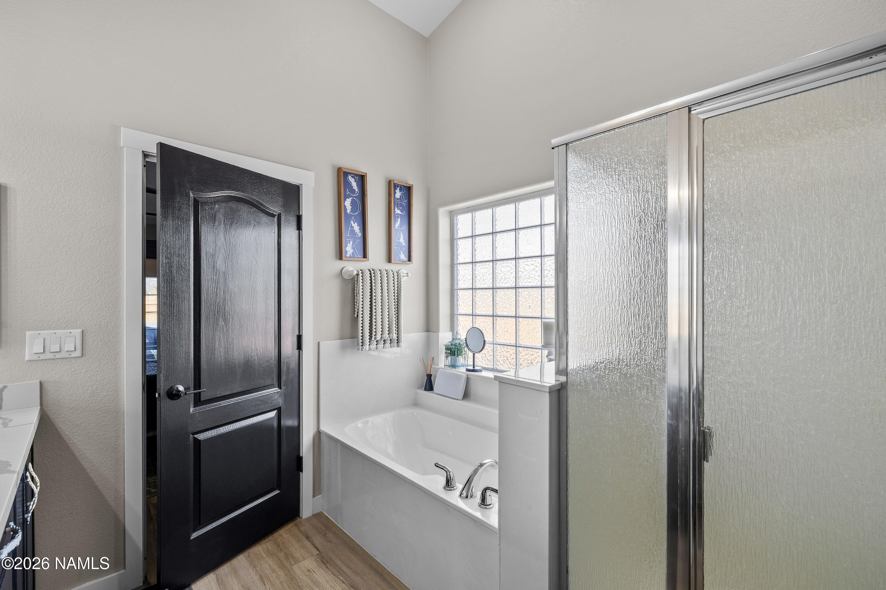 9534 North Aldrich Road Flagstaff, AZ 86004 - Photo 23 of 31 a bathroom with a bathtub and a sink