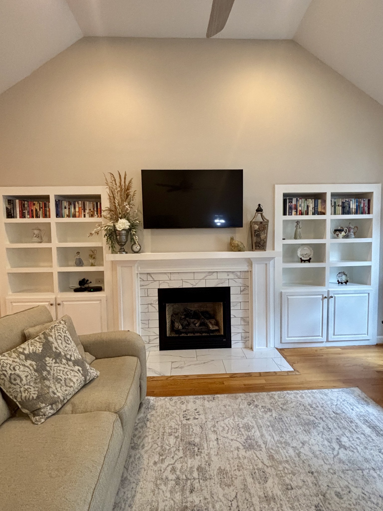 498 Dearman Street Smithville, TN 37166 - Photo 11 of 39 a living room with a fireplace a flat screen tv and a fireplace