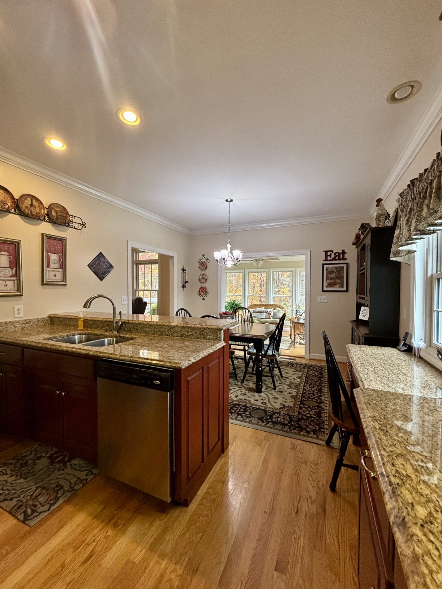 498 Dearman Street Smithville, TN 37166 - Photo 16 of 39 a spacious kitchen with stainless steel appliances granite countertop a sink and cabinets
