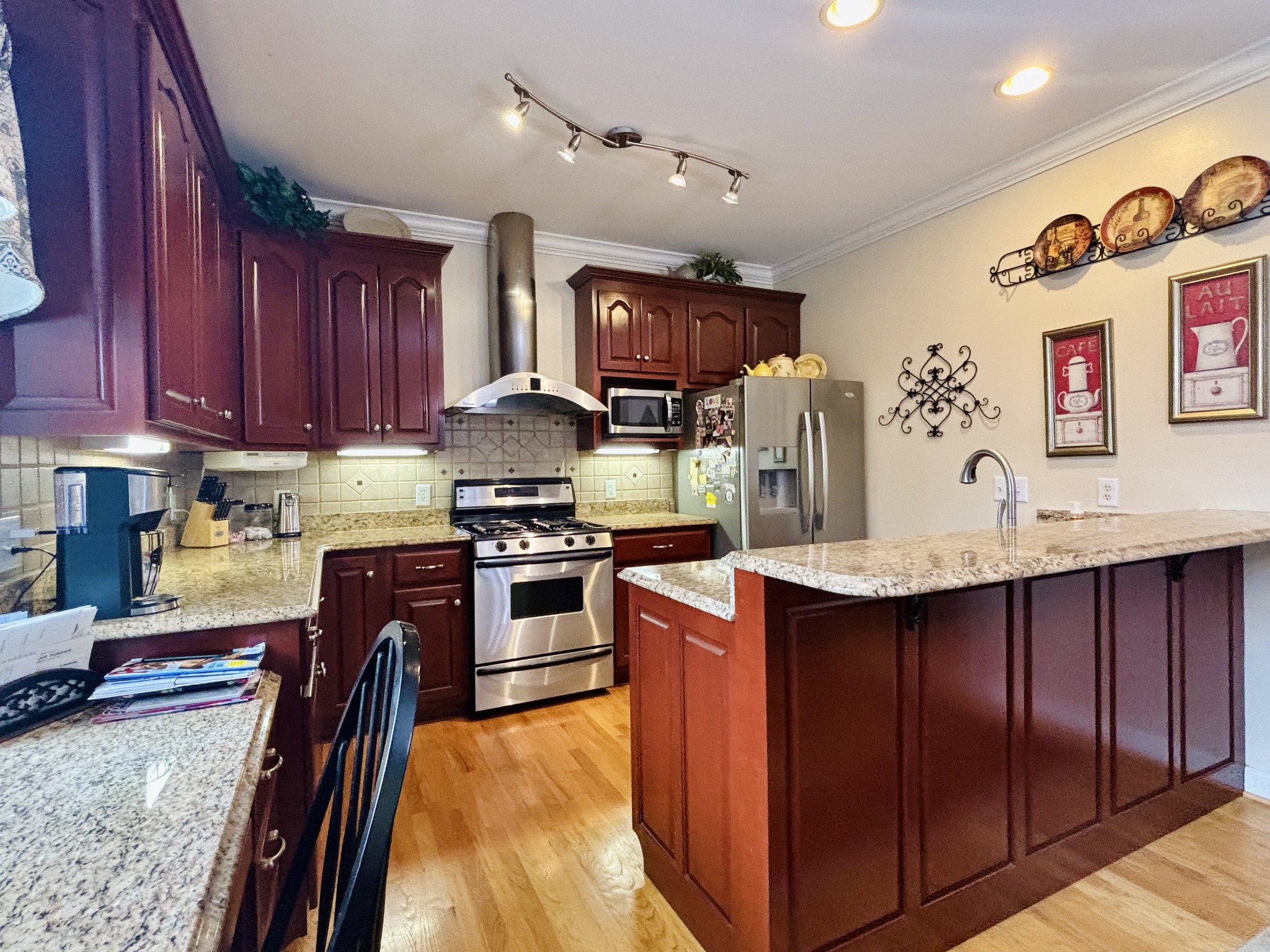 498 Dearman Street Smithville, TN 37166 - Photo 18 of 39 a kitchen with stainless steel appliances granite countertop a sink stove and refrigerator