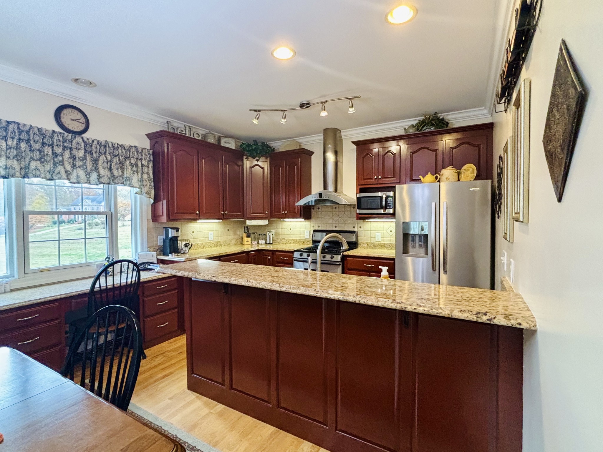 498 Dearman Street Smithville, TN 37166 - Photo 19 of 39 a kitchen with granite countertop a sink stove and refrigerator