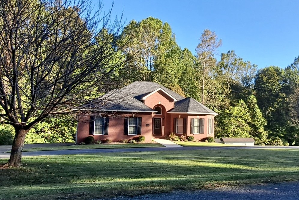 498 Dearman Street Smithville, TN 37166 - Photo 2 of 39 a front view of a house with a garden