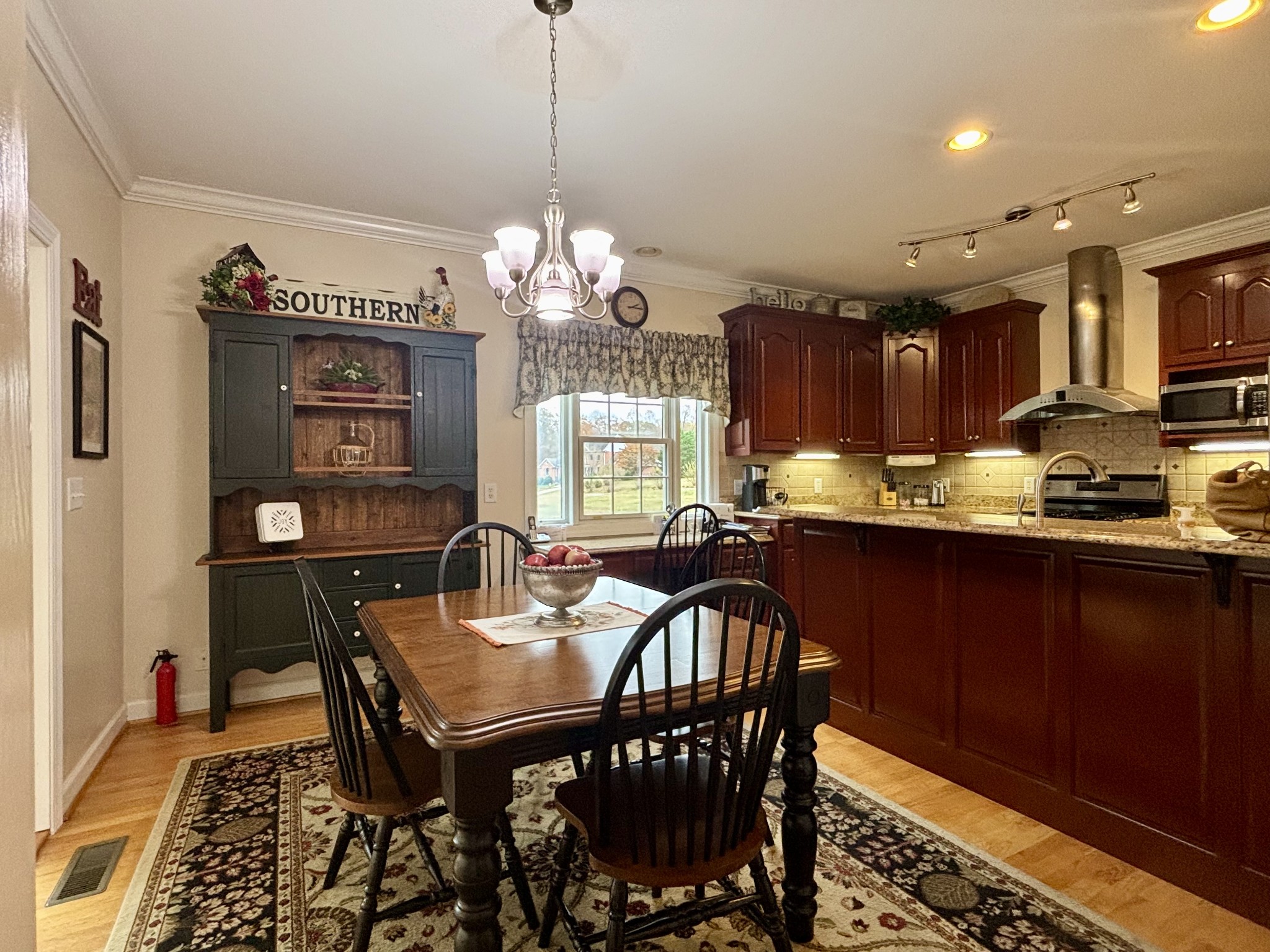 498 Dearman Street Smithville, TN 37166 - Photo 21 of 39 a view of a dining room with furniture window and wooden floor