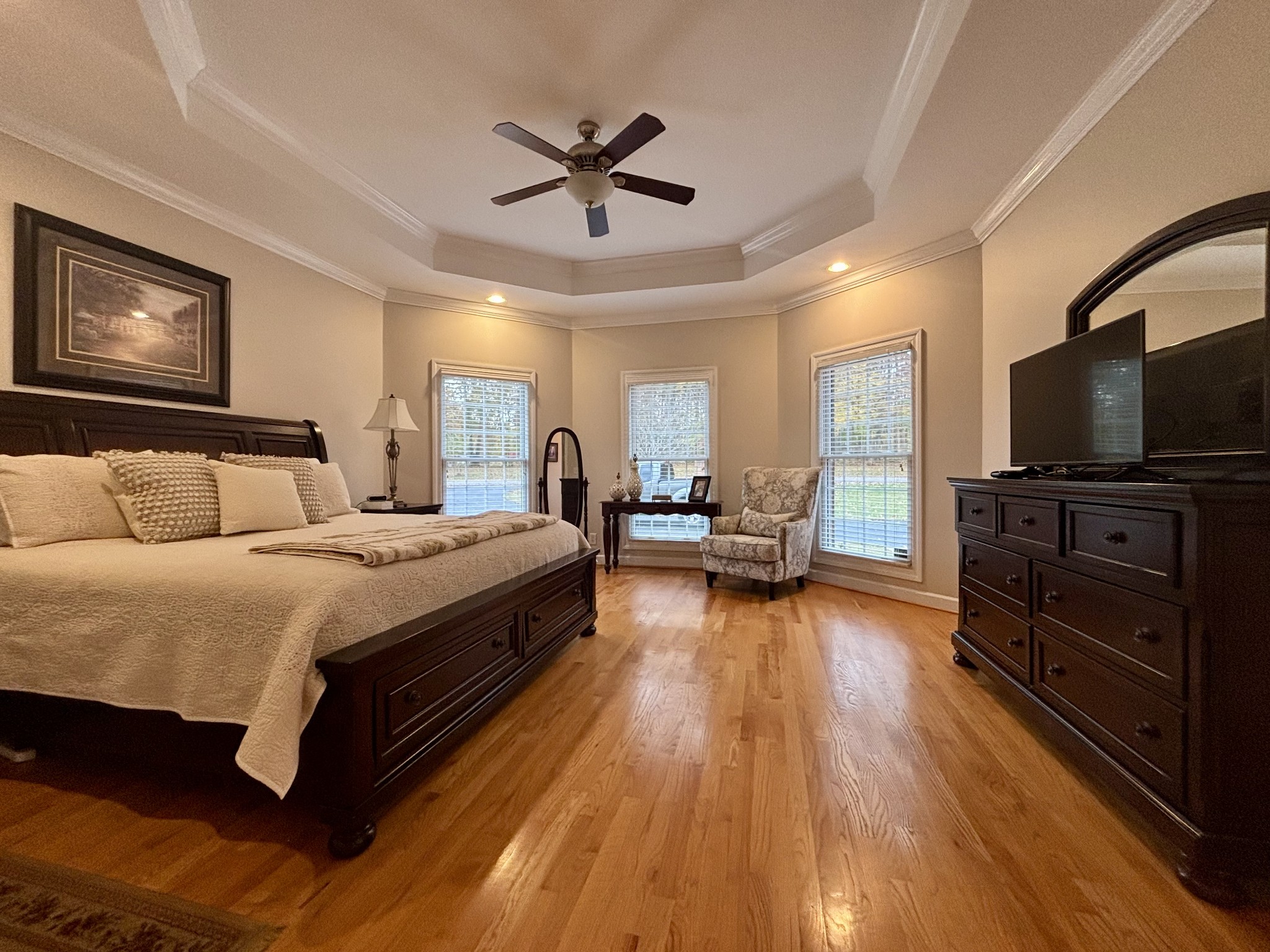 498 Dearman Street Smithville, TN 37166 - Photo 24 of 39 a spacious bedroom with a bed and a flat screen tv