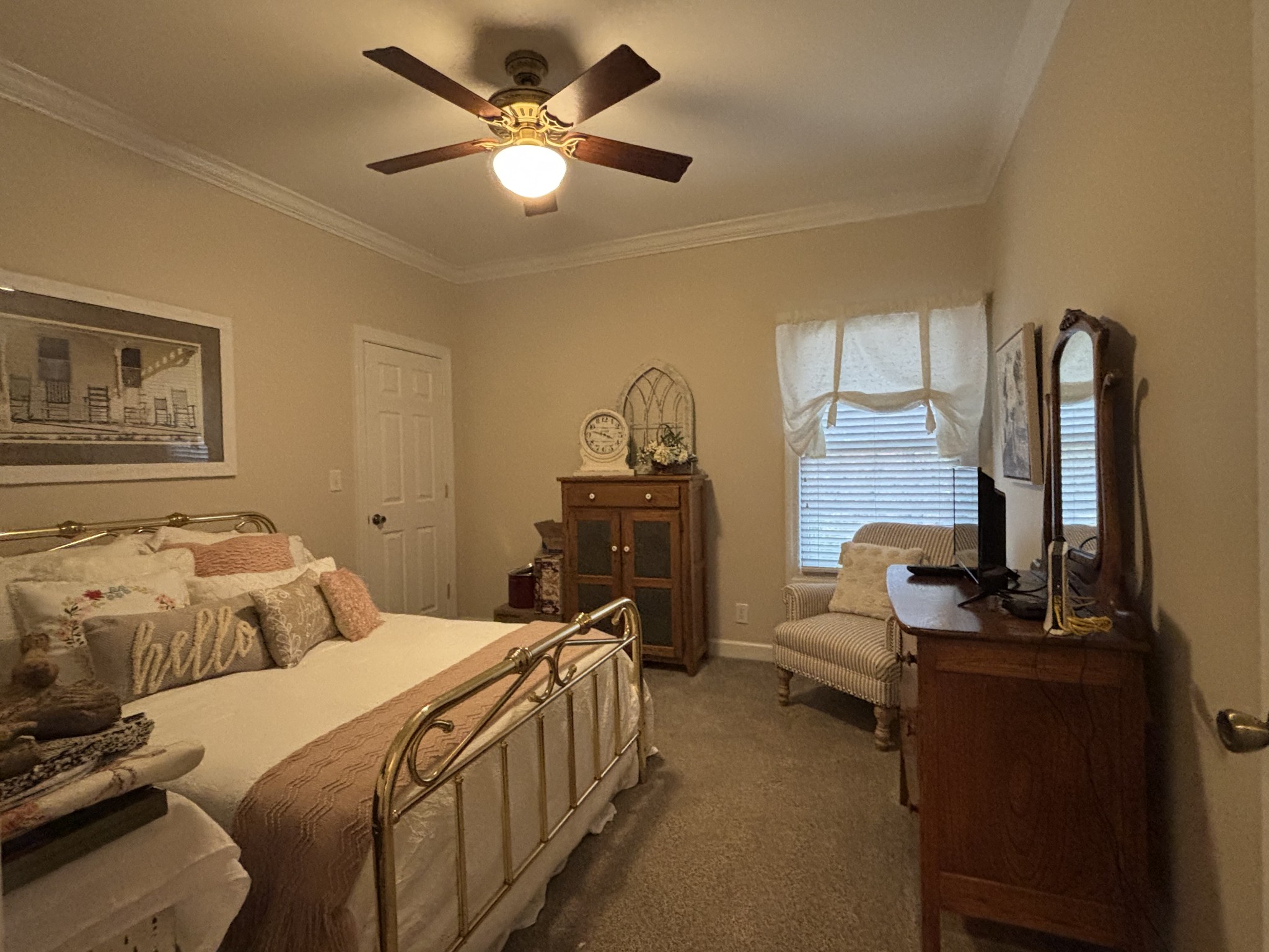 498 Dearman Street Smithville, TN 37166 - Photo 27 of 39 a bedroom with a bed and a chandelier