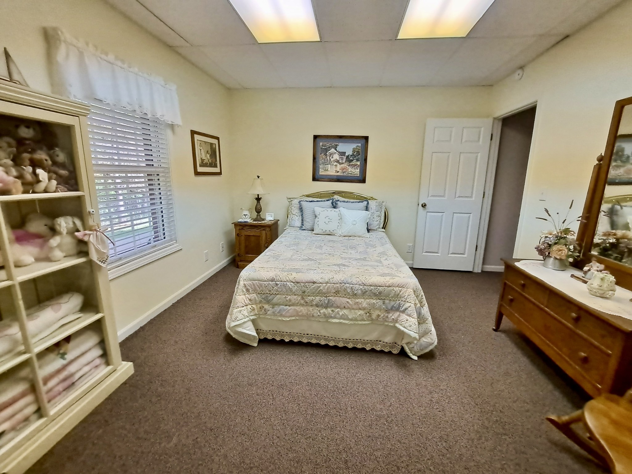 498 Dearman Street Smithville, TN 37166 - Photo 35 of 39 a bedroom with a bed and a dresser in it