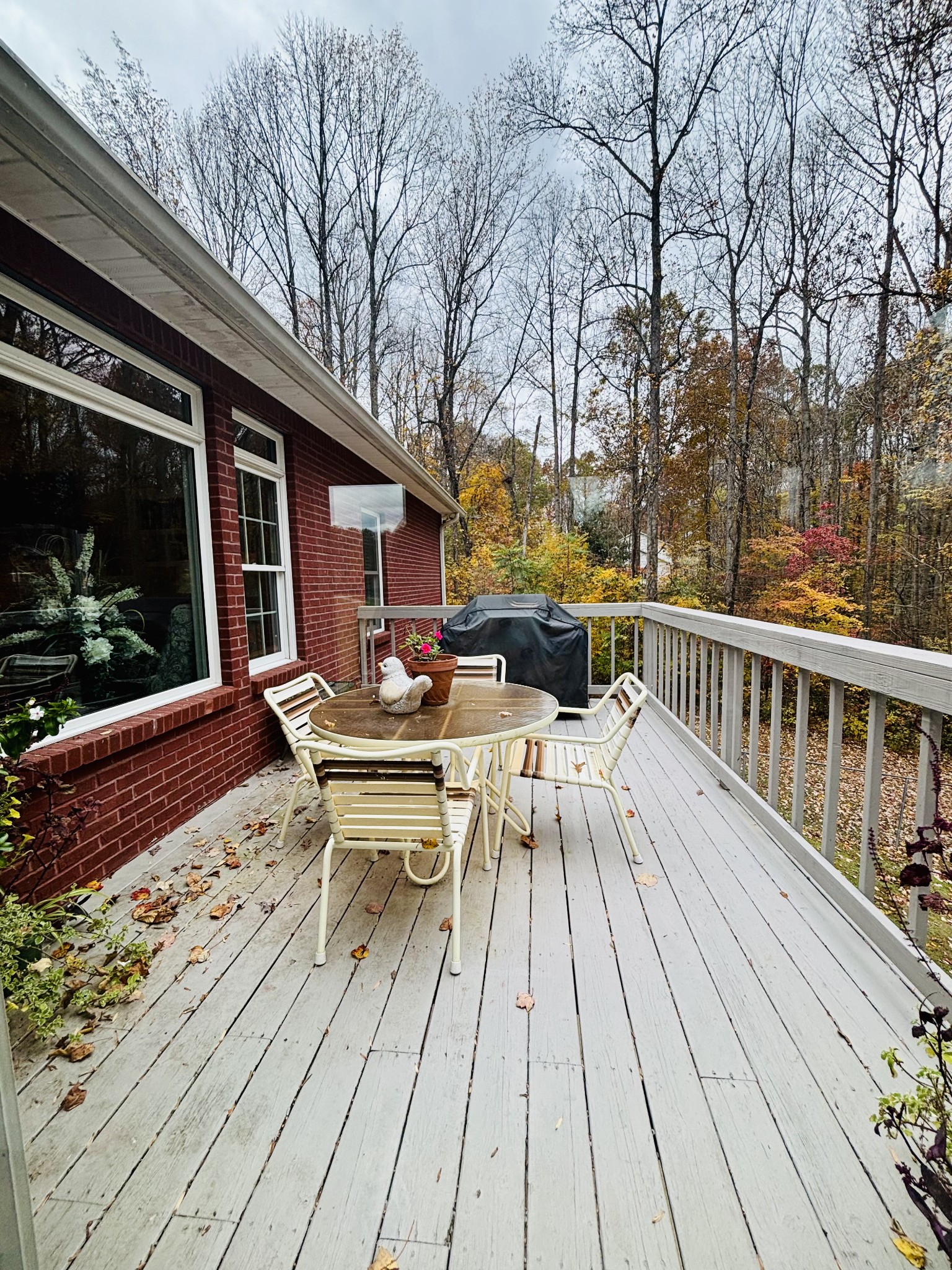 498 Dearman Street Smithville, TN 37166 - Photo 39 of 39 a view of a patio with dining table and chairs with wooden floor and fence