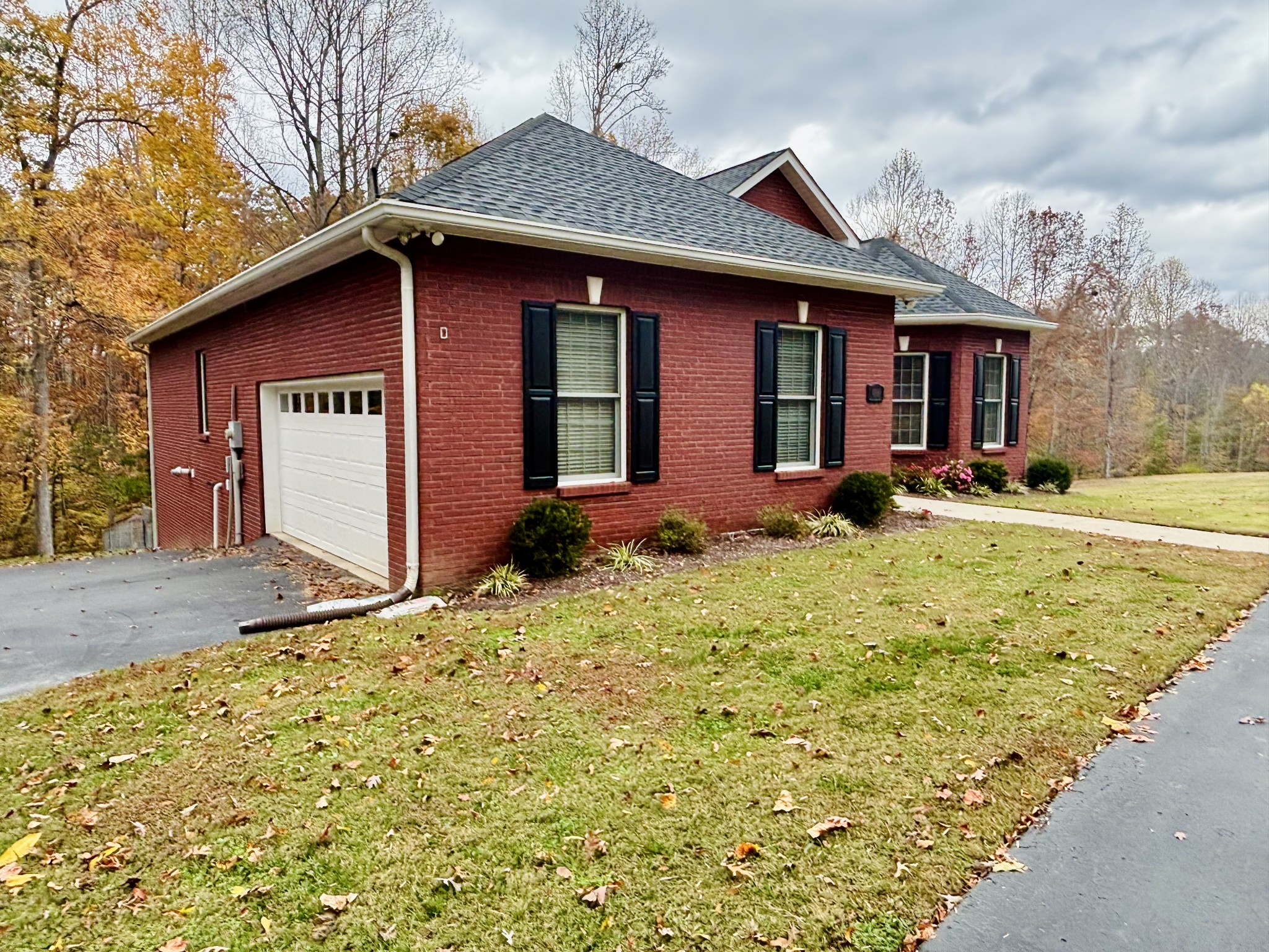 498 Dearman Street Smithville, TN 37166 - Photo 4 of 39 a front view of a house with garden