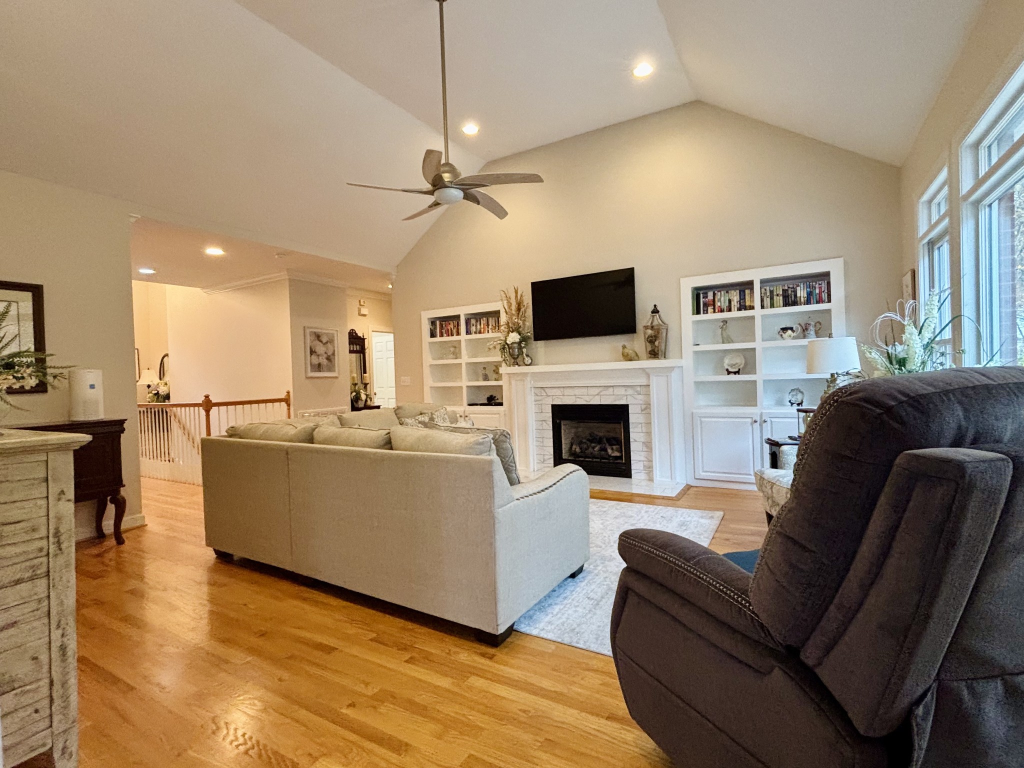498 Dearman Street Smithville, TN 37166 - Photo 10 of 39 a living room with furniture a fireplace and a flat screen tv