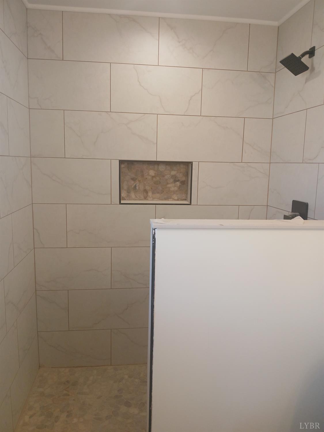 14 Faith Court Rustburg, VA 24588 - Photo 11 of 20 a bathroom with a shower and a sink