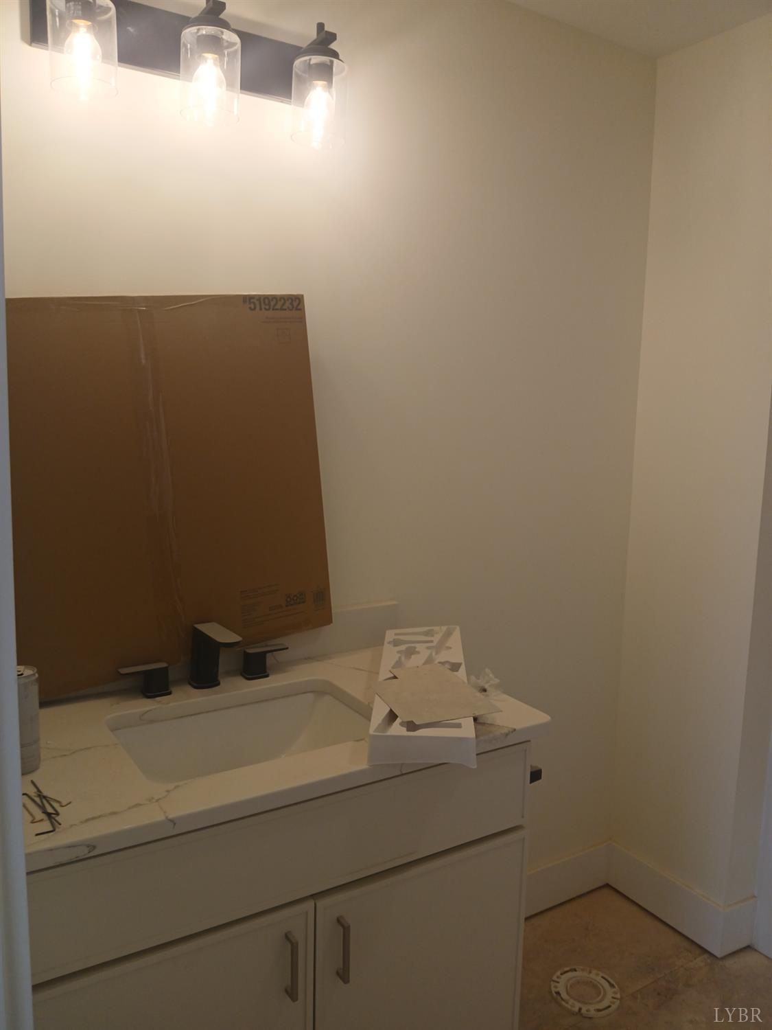 14 Faith Court Rustburg, VA 24588 - Photo 14 of 20 a bathroom with a sink and cabinets