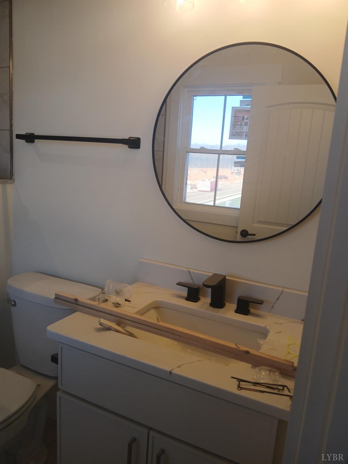 14 Faith Court Rustburg, VA 24588 - Photo 10 of 20 a bathroom with a sink and a mirror