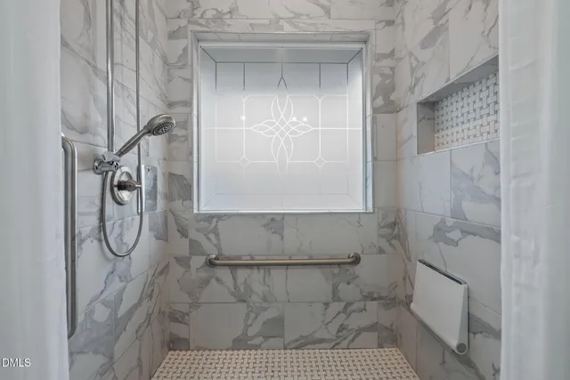 a bathroom with a sink double vanity and a mirror