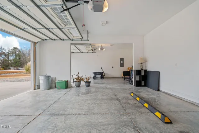 a living room with lots of furniture and a chandelier