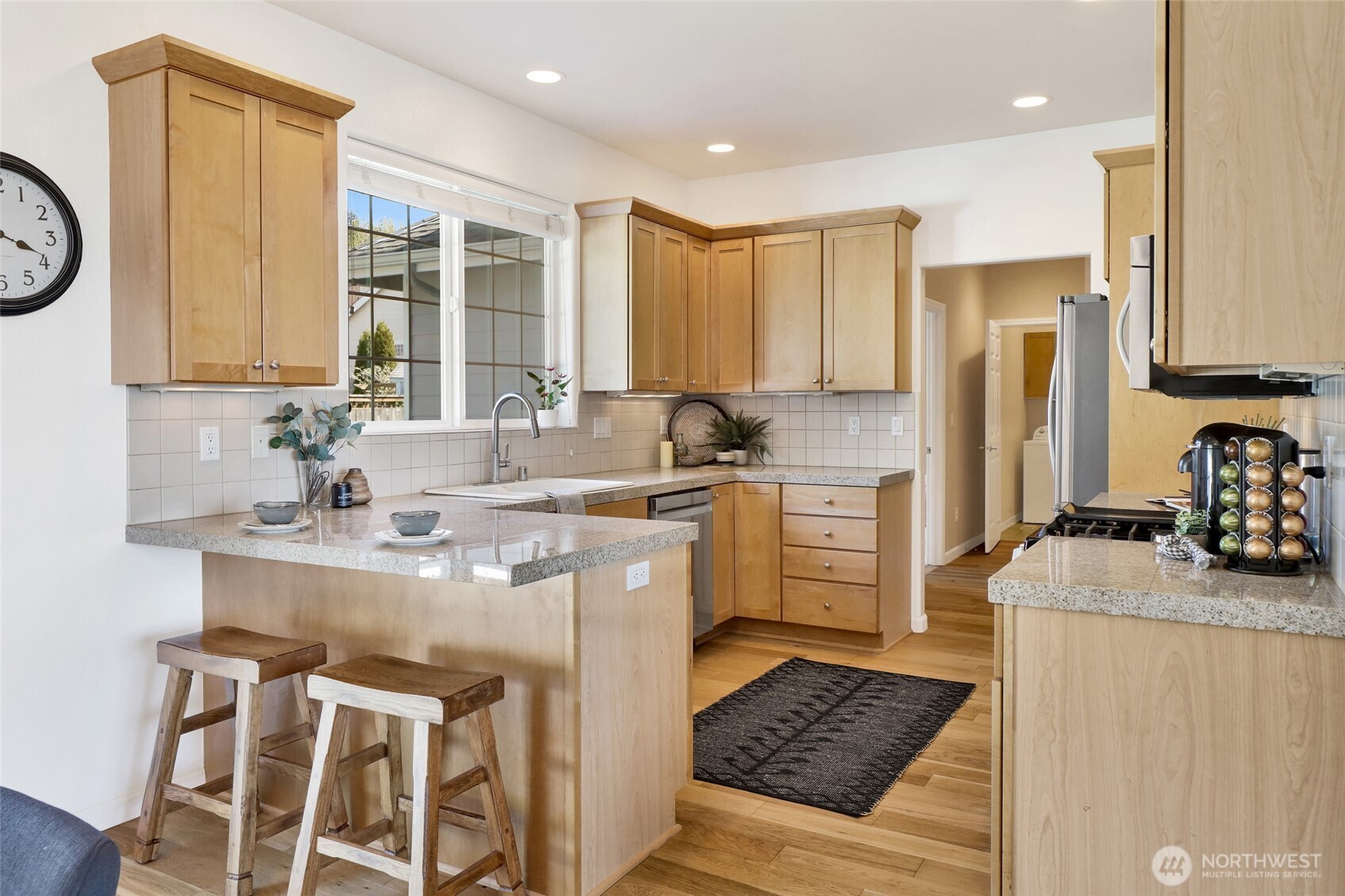 940 Nevada Street Bellingham, WA 98229 - Photo 11 of 31 a kitchen with a sink stove and cabinets