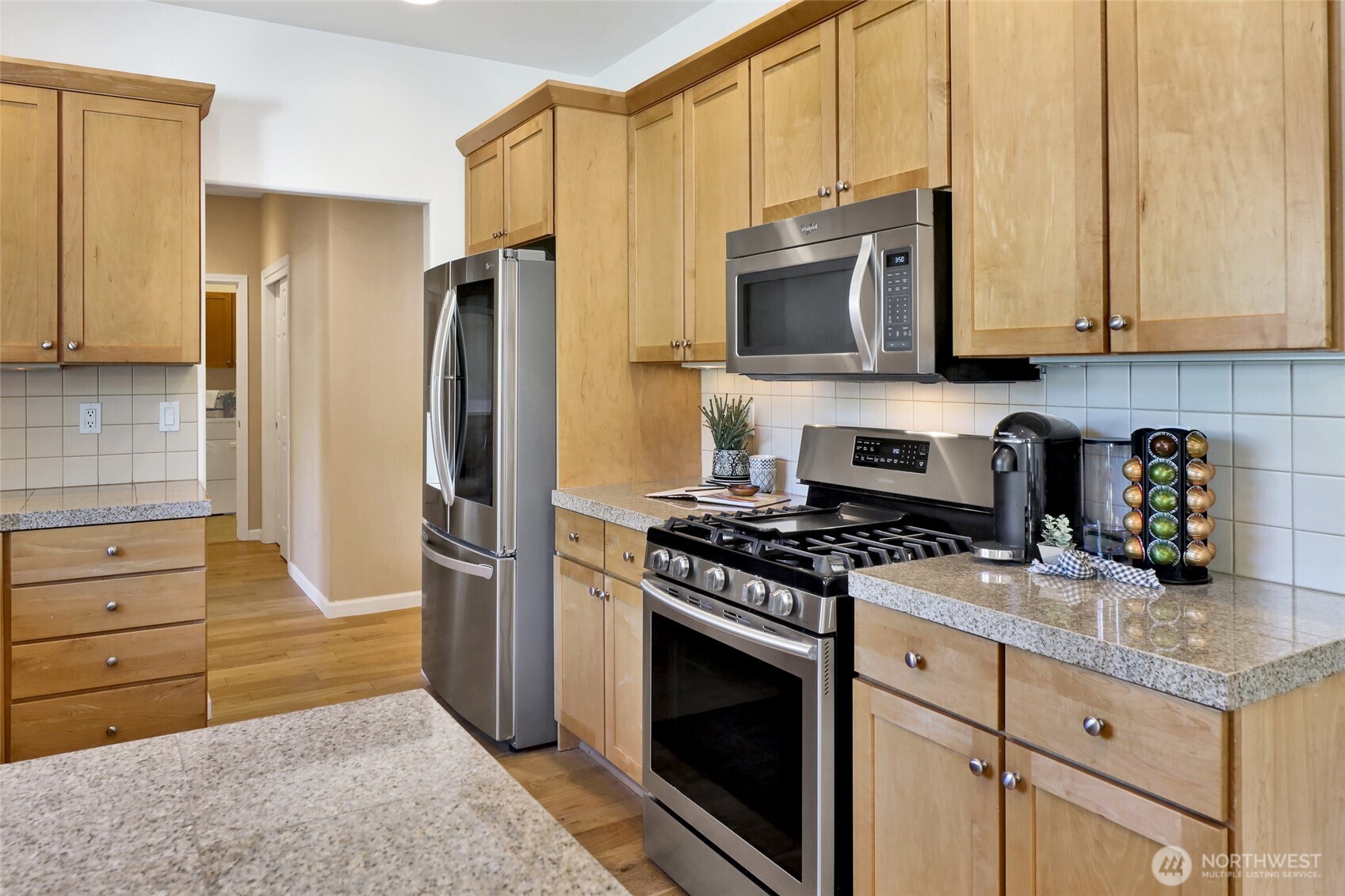 940 Nevada Street Bellingham, WA 98229 - Photo 12 of 31 a kitchen with stainless steel appliances granite countertop a stove and a refrigerator