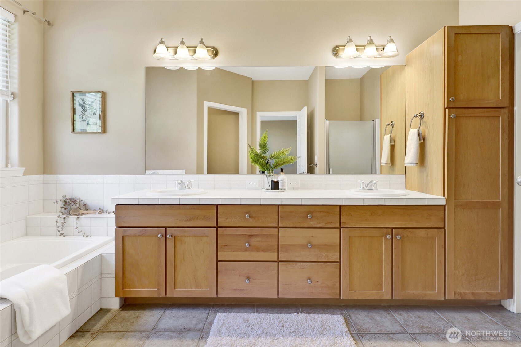 940 Nevada Street Bellingham, WA 98229 - Photo 21 of 31 a bathroom with a double vanity sink double and mirror