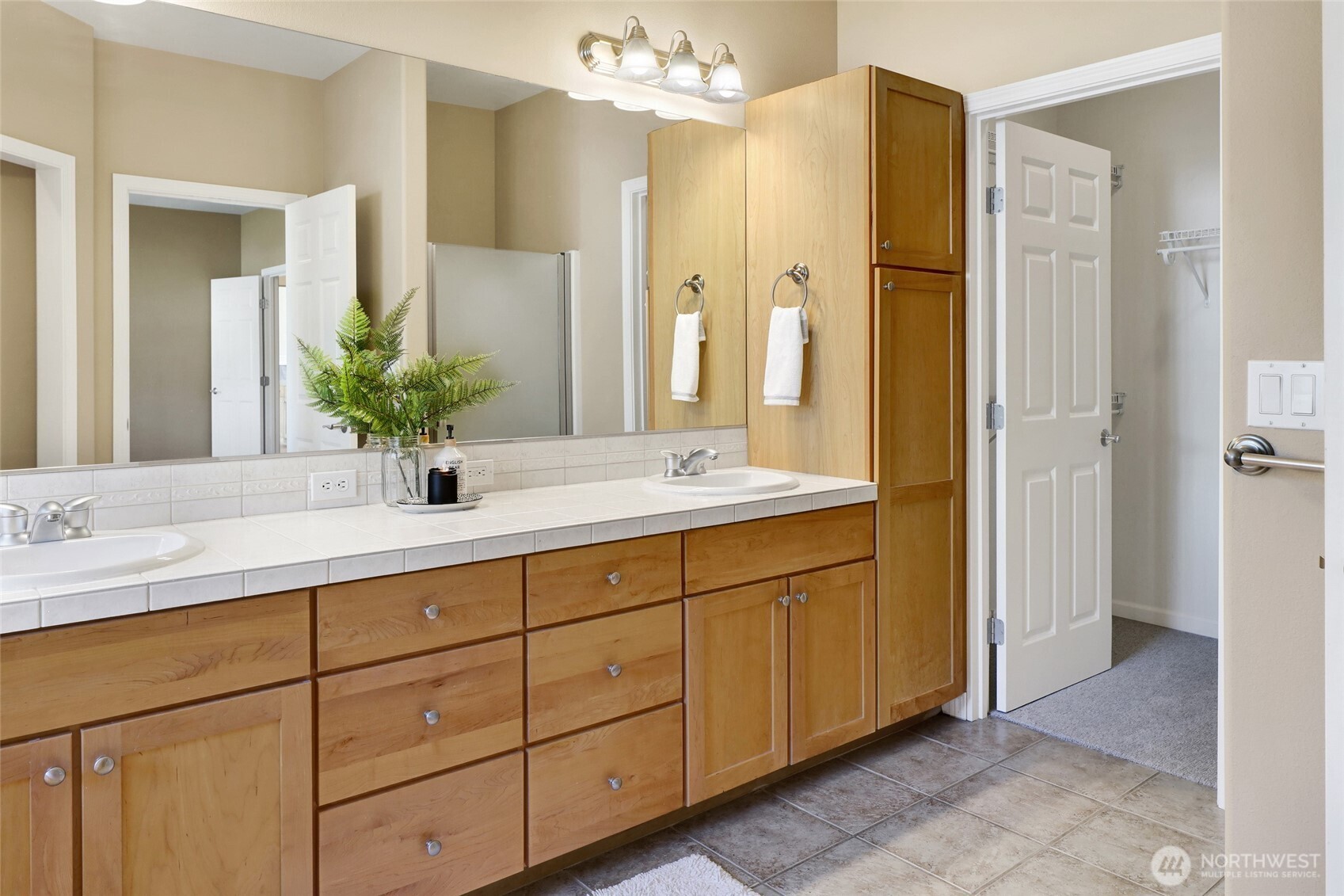 940 Nevada Street Bellingham, WA 98229 - Photo 23 of 31 a bathroom with double vanity sinks and a mirror