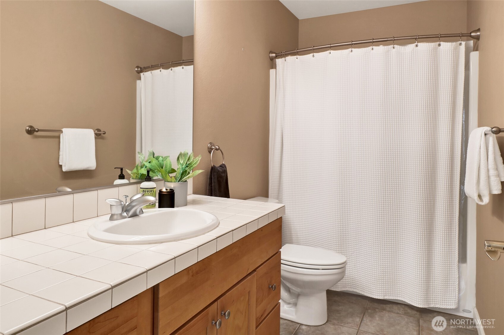 940 Nevada Street Bellingham, WA 98229 - Photo 25 of 31 a bathroom with a sink vanity mirror and toilet