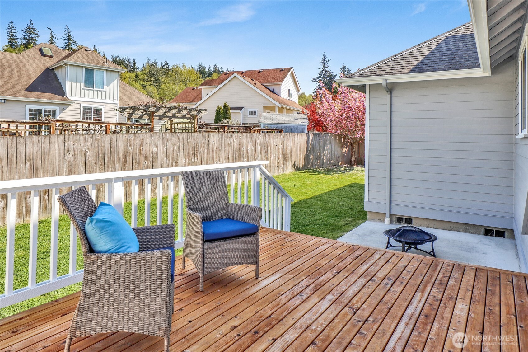940 Nevada Street Bellingham, WA 98229 - Photo 30 of 31 a view of a chair and table on the wooden deck
