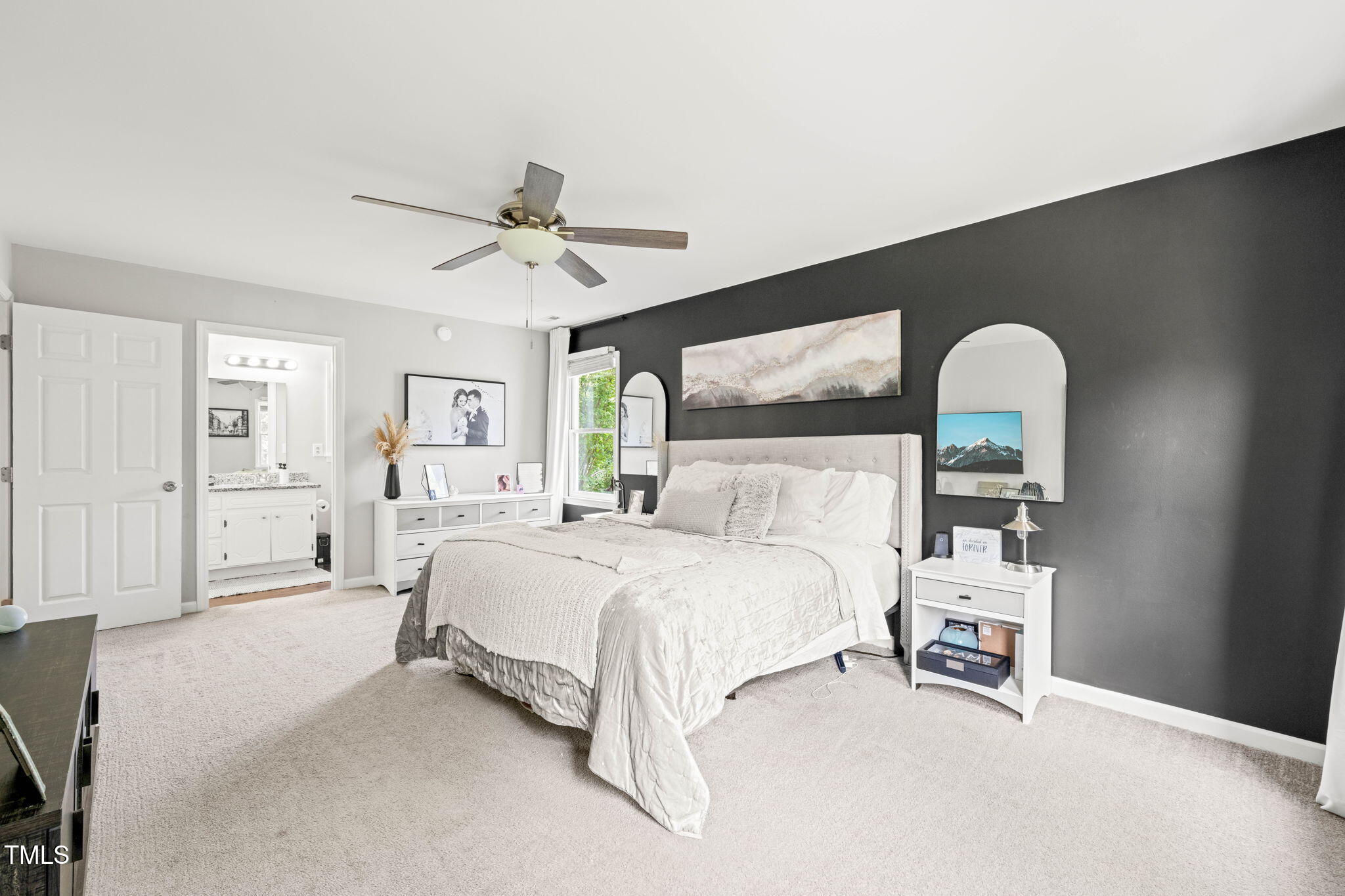 21 Cedar Hill Drive Durham, NC 27713 - Photo 16 of 45 a bedroom with a bed and a chandelier