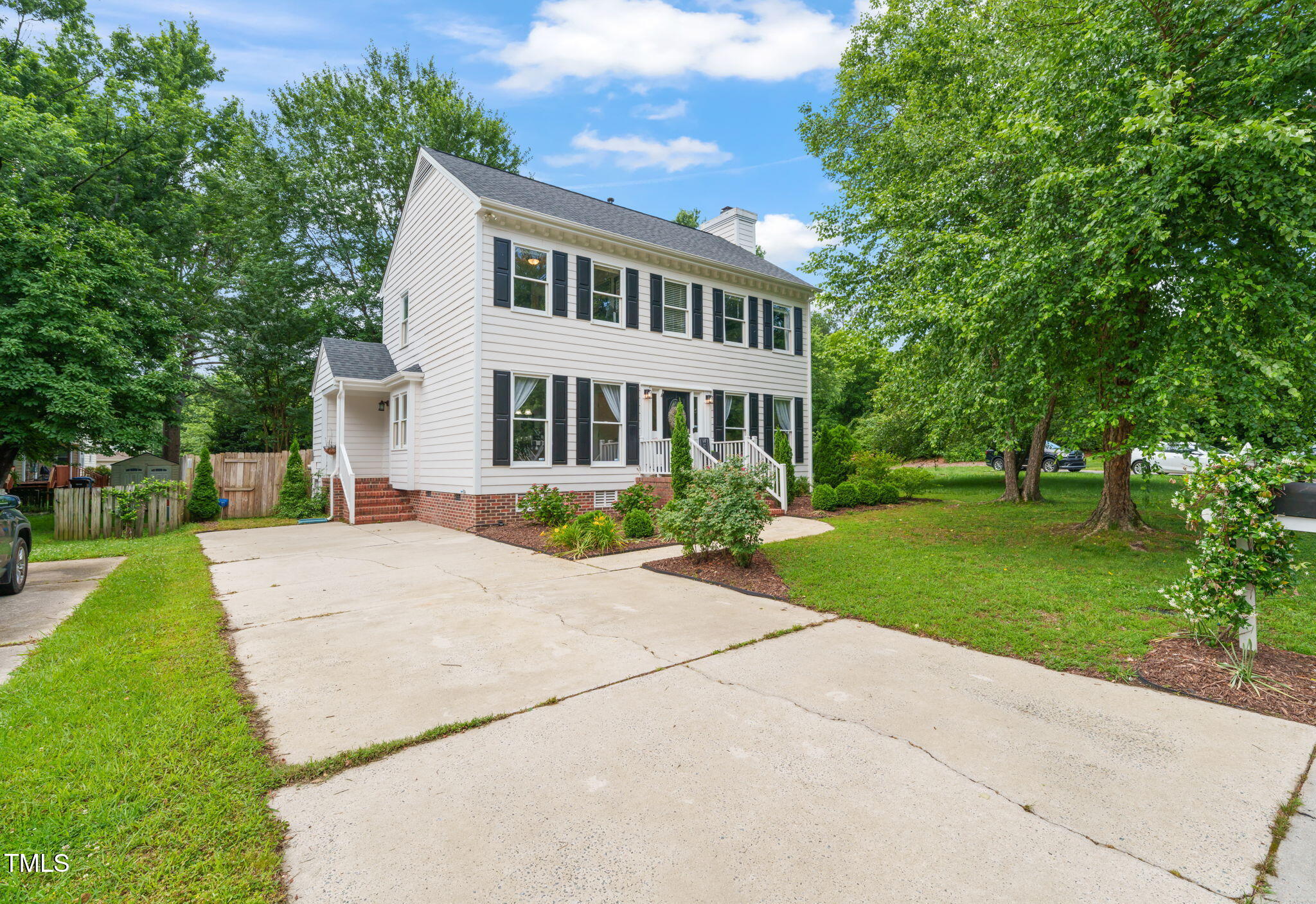 21 Cedar Hill Drive Durham, NC 27713 - Photo 41 of 45 a front view of a house with a yard and trees