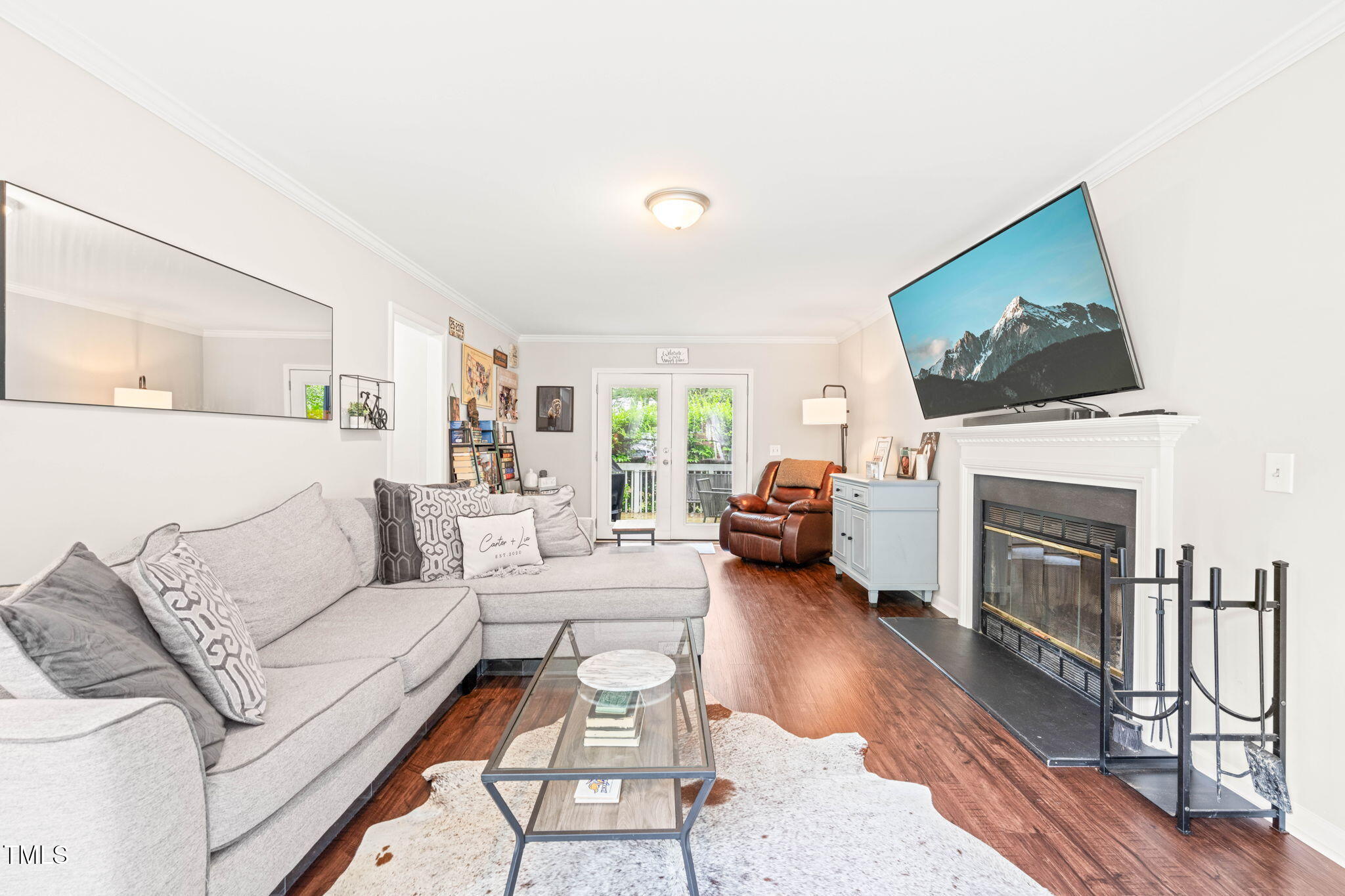 21 Cedar Hill Drive Durham, NC 27713 - Photo 6 of 45 a living room with furniture a fireplace and a flat screen tv