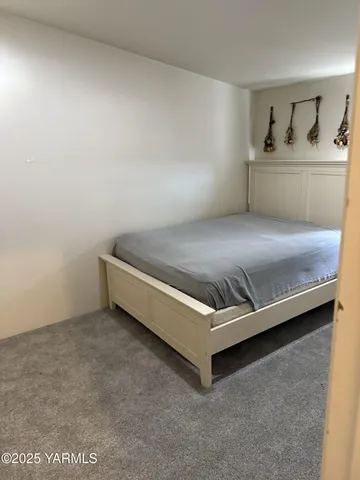 a room with a bed and window