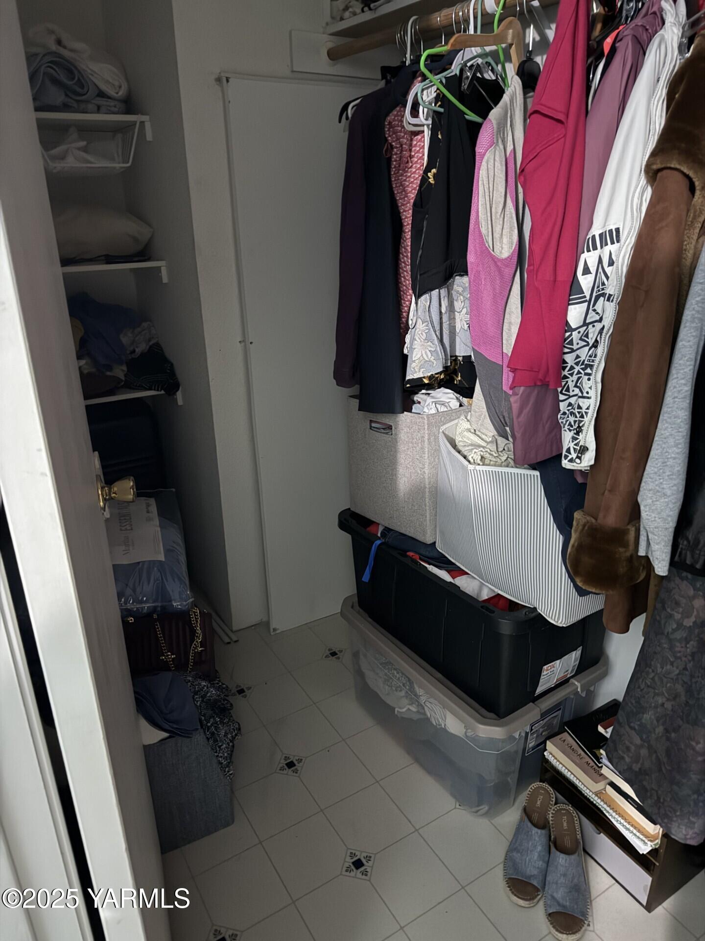 605 Dean Avenue Granger, WA 98932 - Photo 19 of 27 a room with clothes and shoes