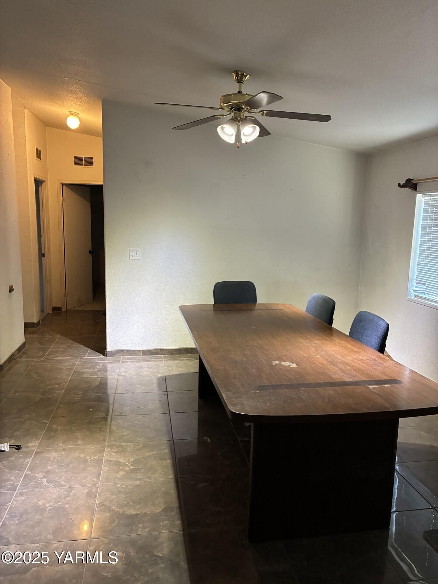 605 Dean Avenue Granger, WA 98932 - Photo 7 of 27 a room with a table chairs and chandelier