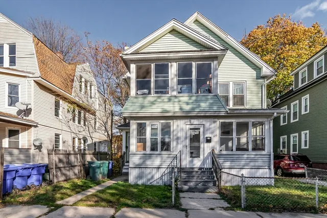 a front view of a house with yard