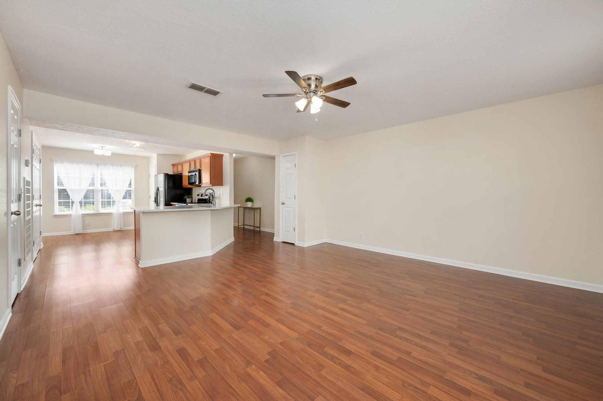 3016 London View Murfreesboro, TN 37128 - Photo 5 of 19 a view of a kitchen with wooden floor and a kitchen